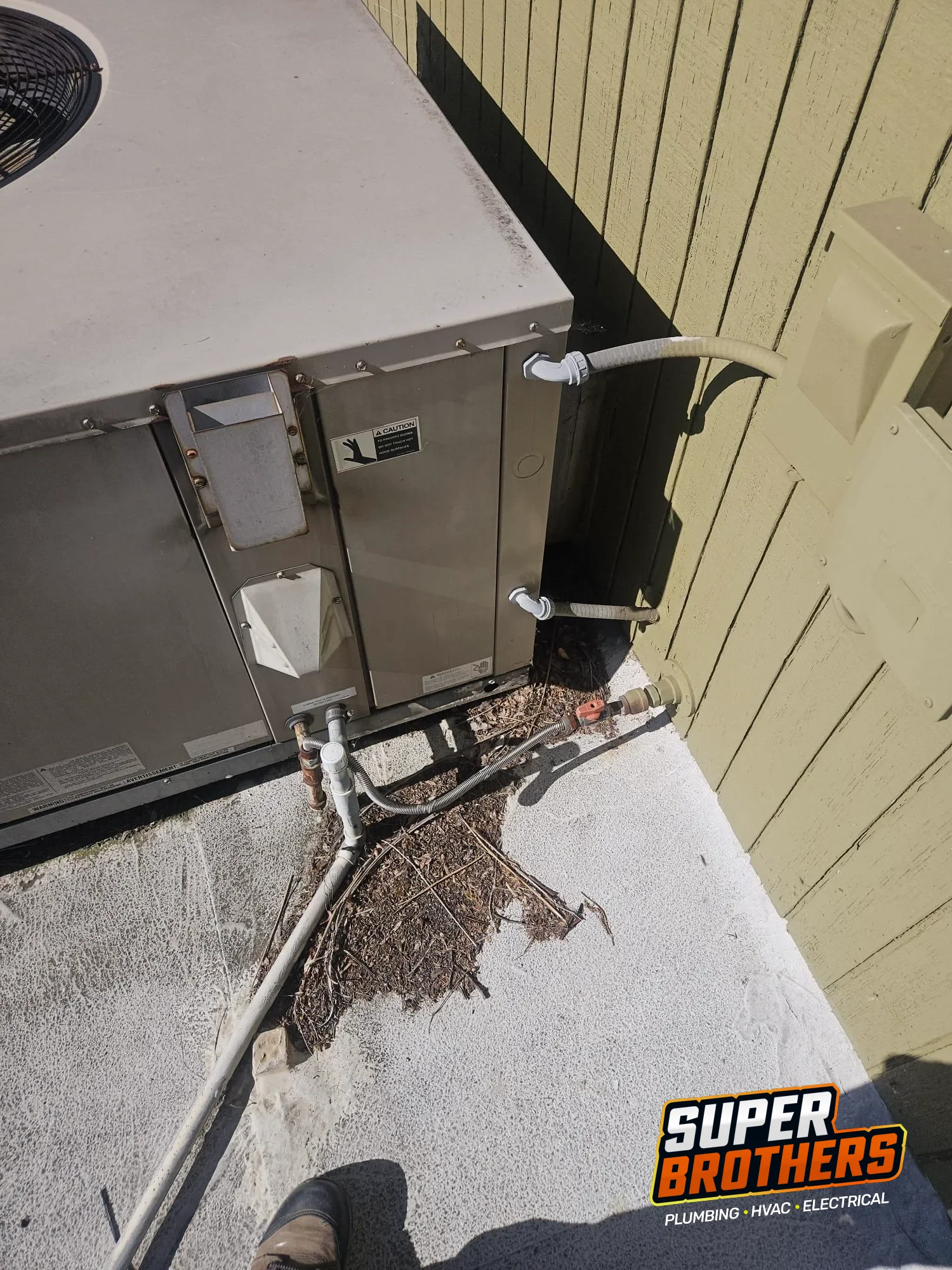 side access area of rooftop packaged AC unit with conduit and service connections side access area of rooftop packaged AC unit with conduit and service connections