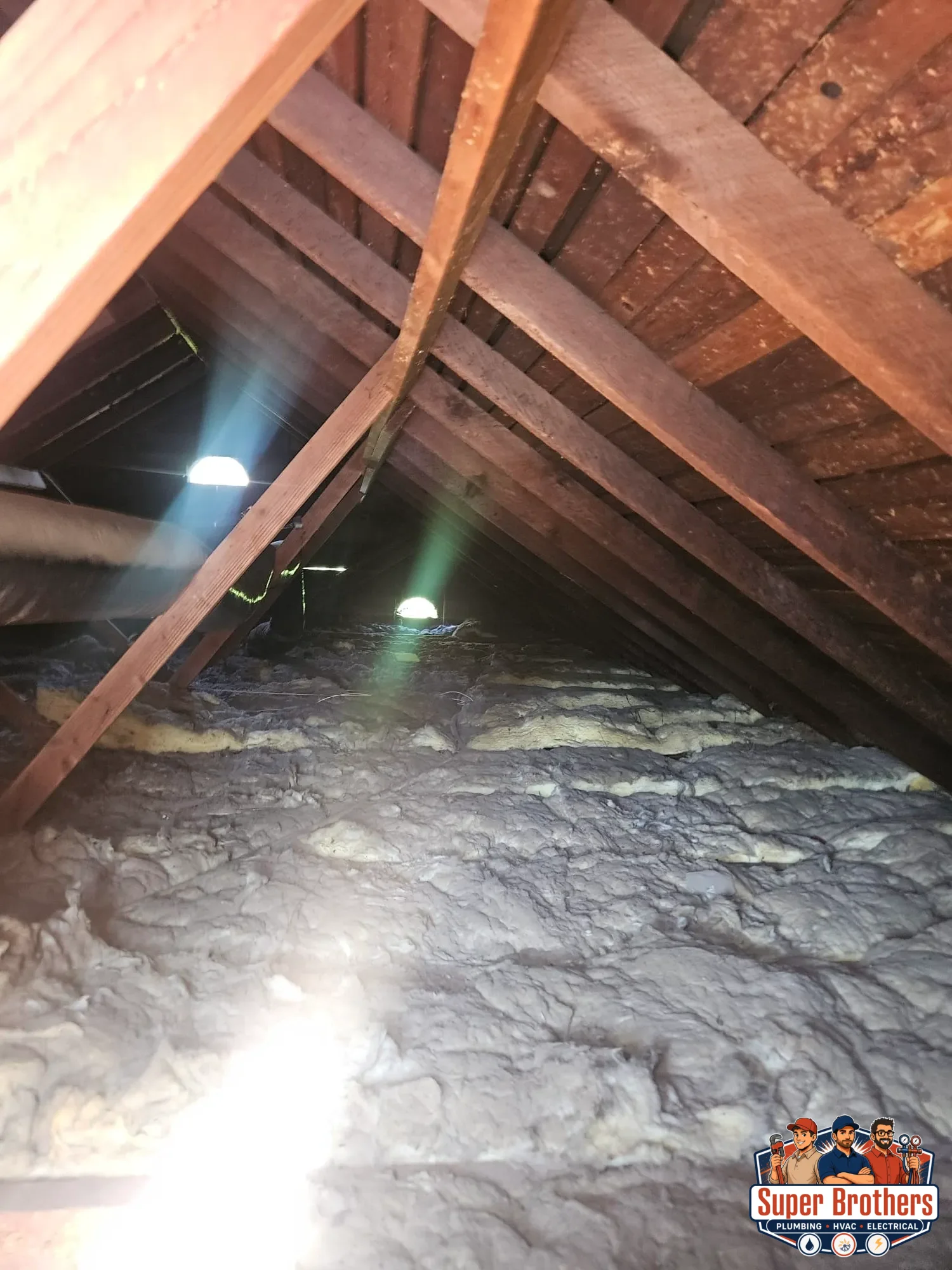 attic insulation and duct access area checked during AC tune up