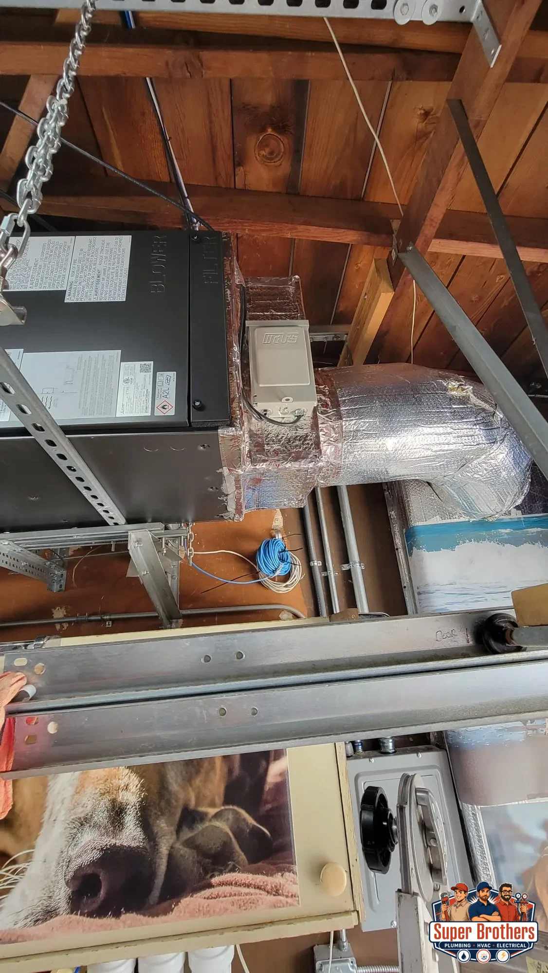 Mitsubishi SVZ air handler installed overhead with sealed insulated duct connection Mitsubishi SVZ air handler installed overhead with sealed insulated duct connection